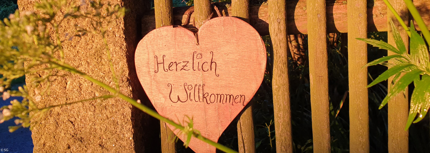 Schild "Herzlich willkommen!"