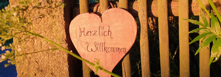 Schild "Herzlich willkommen!"